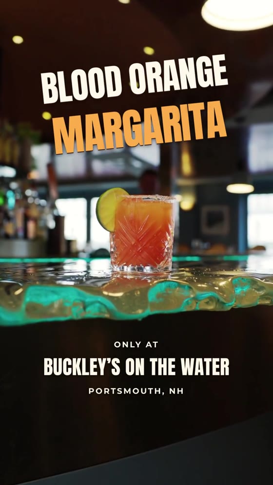 A blood orange margarita on a lit bar beneath a title card reading Blood Orange Margarita